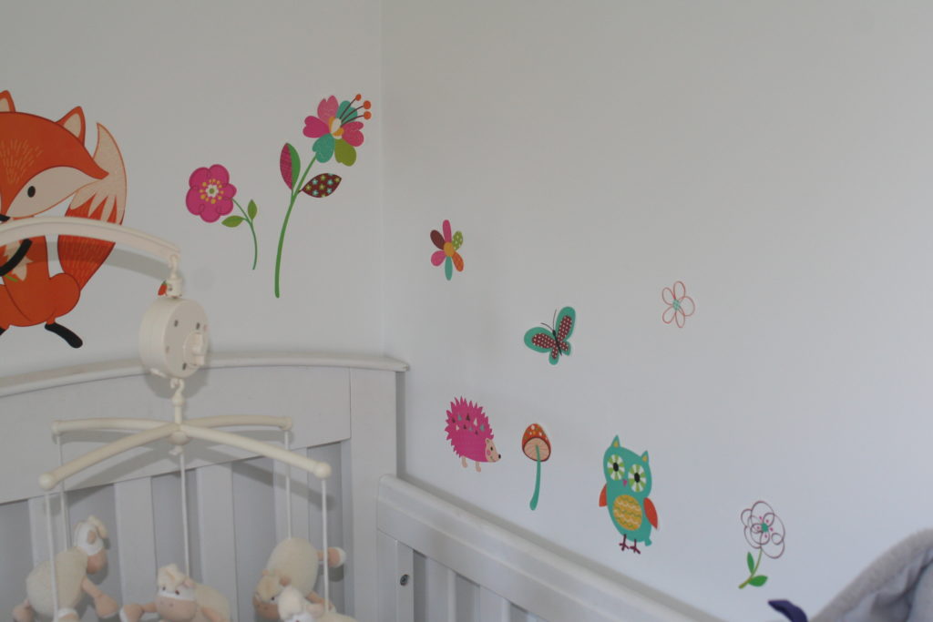 wall stickers, a hedgehog, owl and butterflys and flowers.